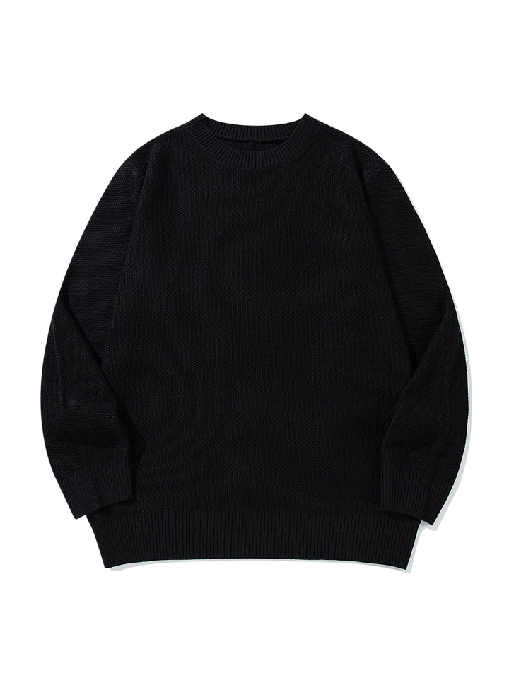 Unisex chunky knit round neck sweater with textured purl stitch and ribbed cuffs