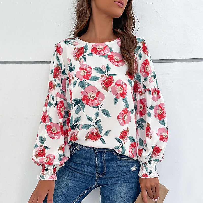 Ladies lightweight blouse with large floral print, volume sleeves and smocked cuffs Mune Fashion