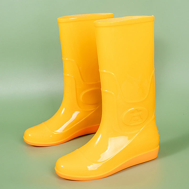 Women Shiny mid-height rain boots made of PVC with a lightweight wedge heel Mune Fashion