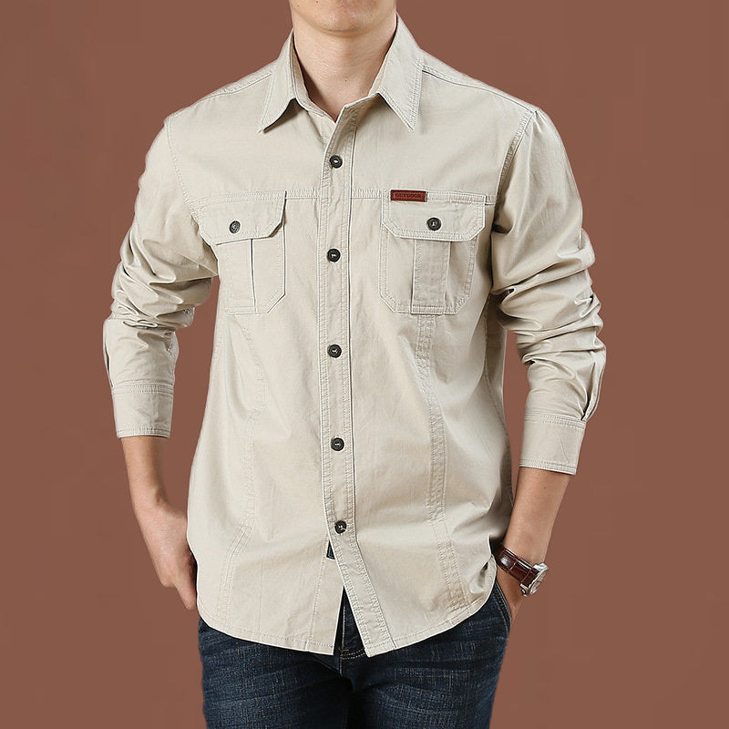 Men's robust cotton twill field shirt with patch flap chest pockets and distinctive seam details.