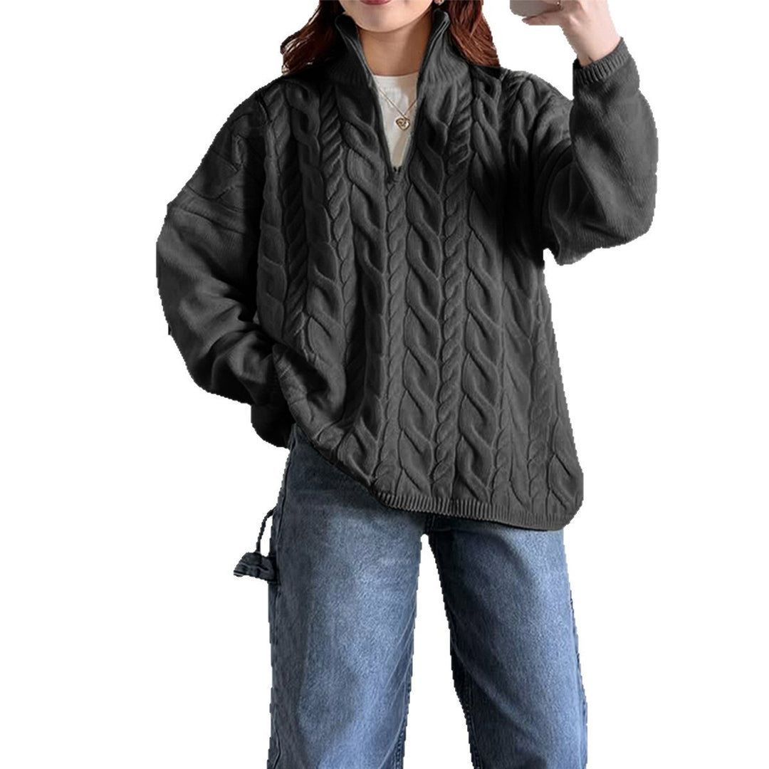 Women's oversized cable knit turtleneck sweater with half zip, high stand-up collar, and rounded hem Mune Fashion