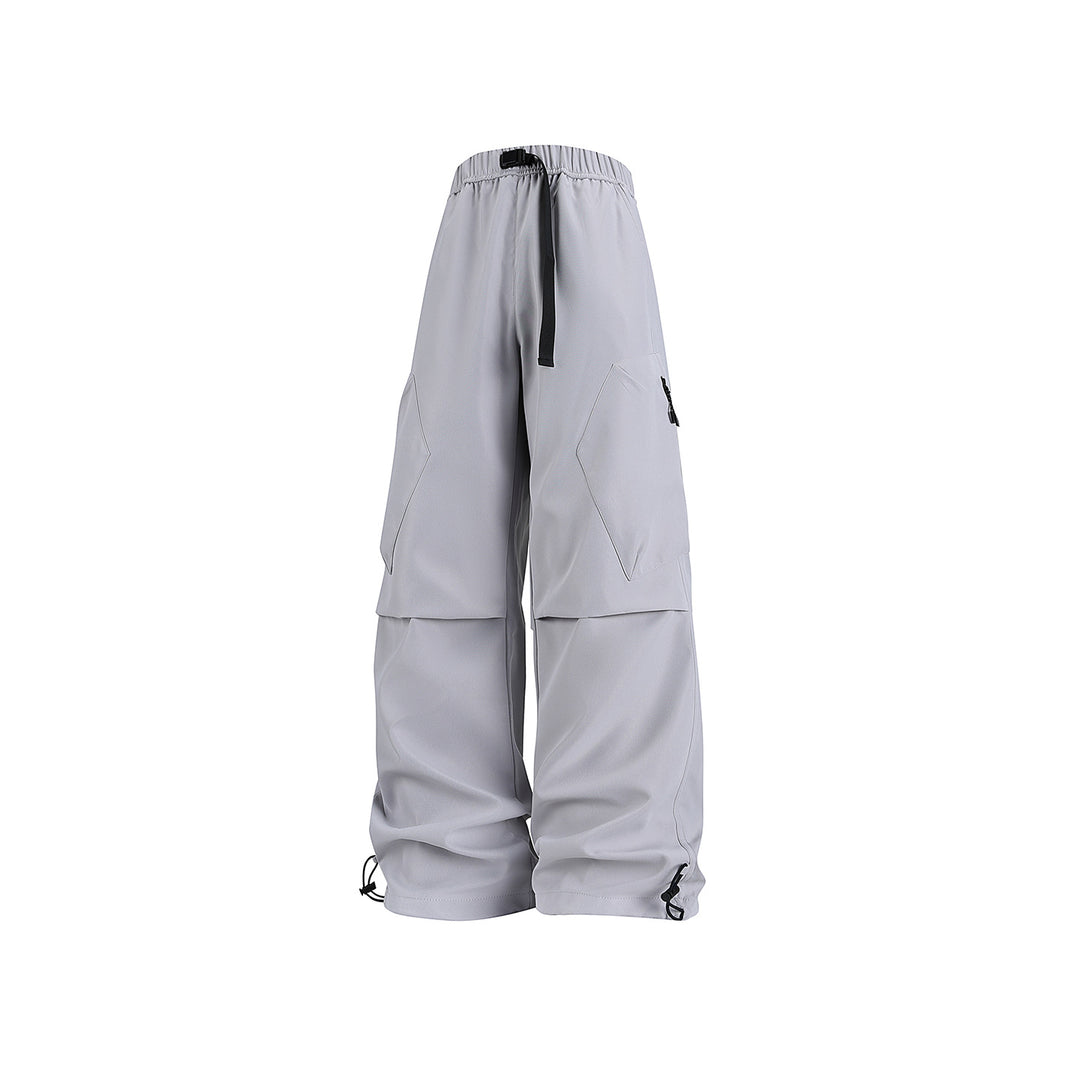 Men's wide cargo pants in baggy style with drawstring waistband, large flap pockets, and adjustable leg openings Drune