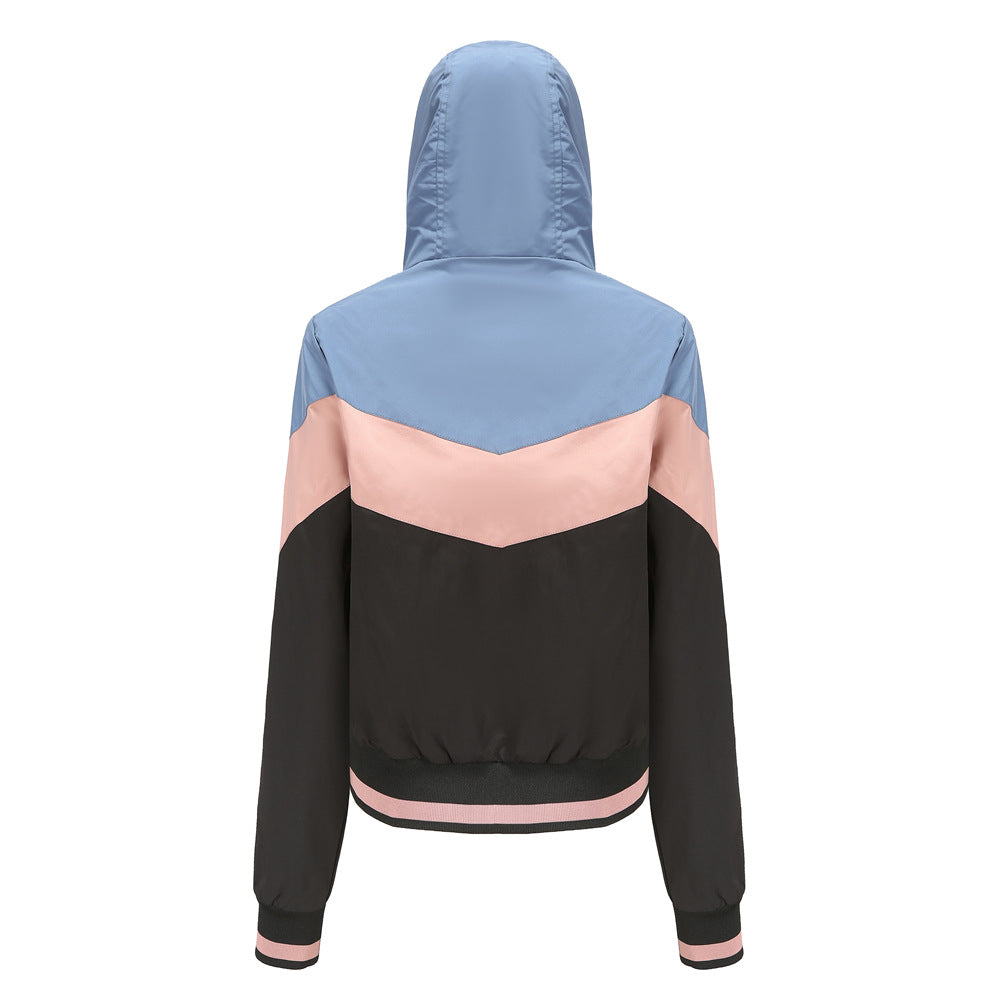 Women's lightweight windbreaker jacket with hood, block panel design, zippered pockets, and elastic hem Mune Fashion