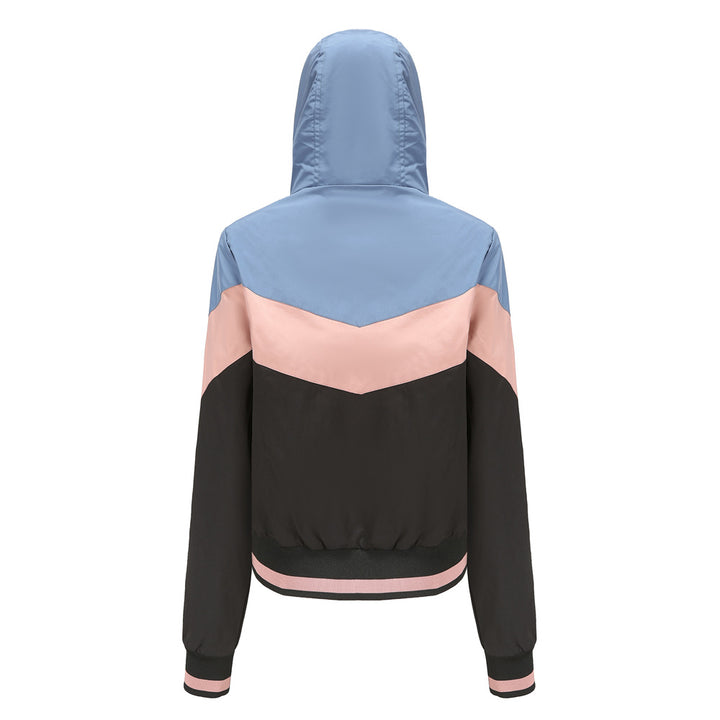 Women's lightweight windbreaker jacket with hood, block panel design, zippered pockets, and elastic hem Mune Fashion