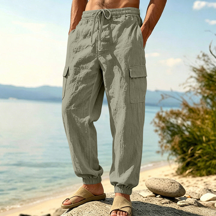 Men's lightweight cargo jogger pants made of linen blend with elastic drawstring waistband, patch flap pockets, and ribbed leg cuffs Mune Fashion