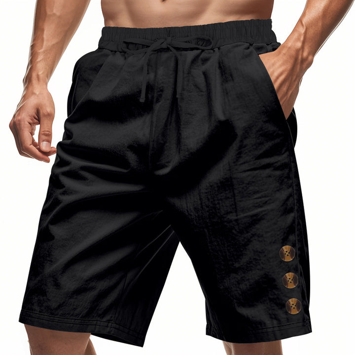 Men's knee-length casual Bermuda shorts with elastic tunnel drawstring waist, side slit pockets, and round decorative appliqués Mune Fashion