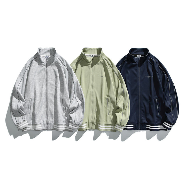 Unisex Sportive Track Jacket in oversized cut with stand-up collar, contrast piping and ribbed cuffs Mune Fashion