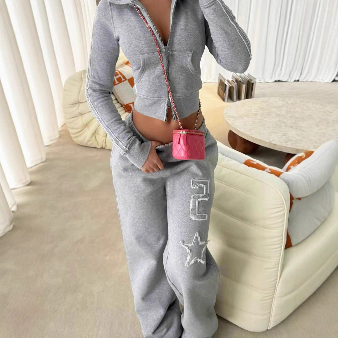 Women's tailored cropped hoodie with full zip, elastic hem, and decorative college print Mune Fashion