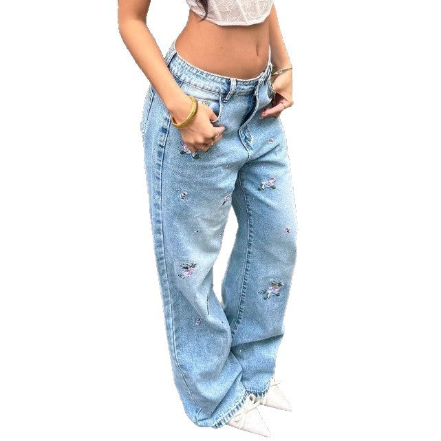 Ladies wide-cut high-waisted denim jeans with floral embroidery and destroyed details Mune Fashion