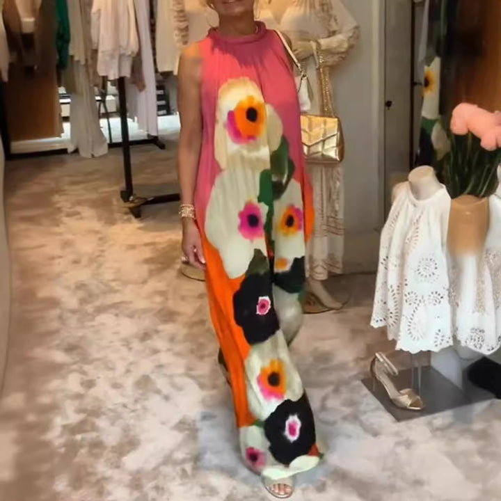Women's sleeveless maxi dress with ruffled high collar, wide palazzo cut, and large floral print Mune Fashion