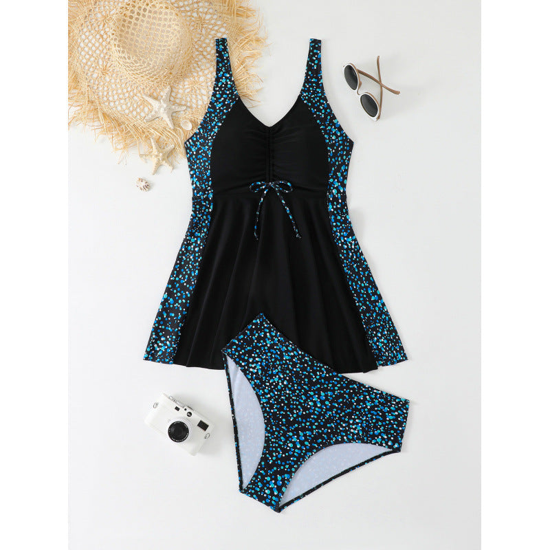 Women's swimsuit with asymmetrical skirt and floral details Mune Fashion