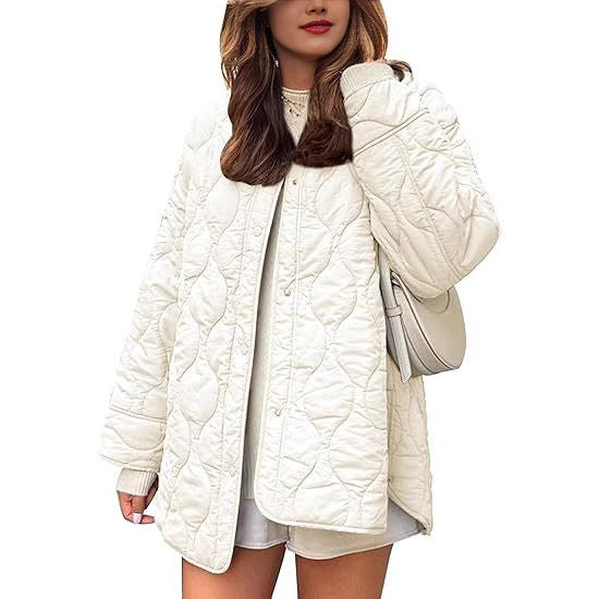 Women's quilted jacket in oversized design with curved quilting and side slit Mune Fashion