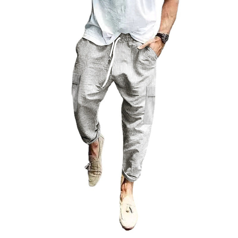 Men's corduroy cargo jogging pants with elastic drawstring waistband, flap pockets, and tapered leg Mune Fashion