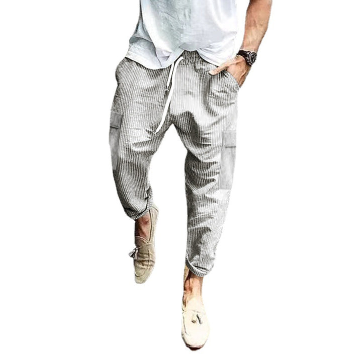 Men's corduroy cargo jogging pants with elastic drawstring waistband, flap pockets, and tapered leg Mune Fashion