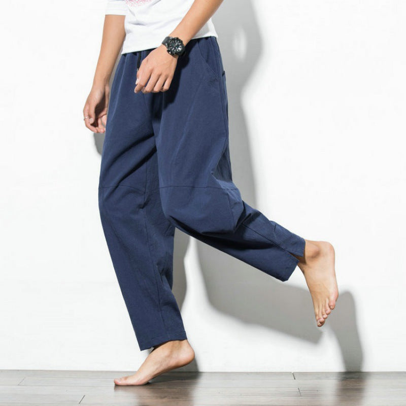 Men's loose harem pants made of cotton blend with elastic waistband, drawstring and side pockets Mune Fashion