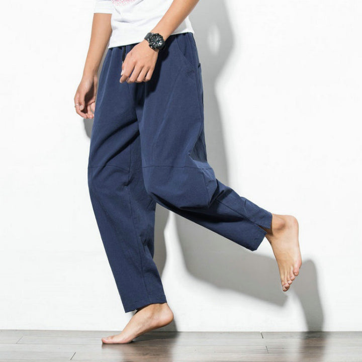 Men's loose harem pants made of cotton blend with elastic waistband, drawstring and side pockets Mune Fashion