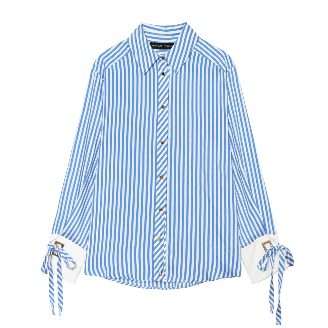Women's oversized blouse with stripes, contrasting cuffs, bow detail and decorative buttons Mune Fashion