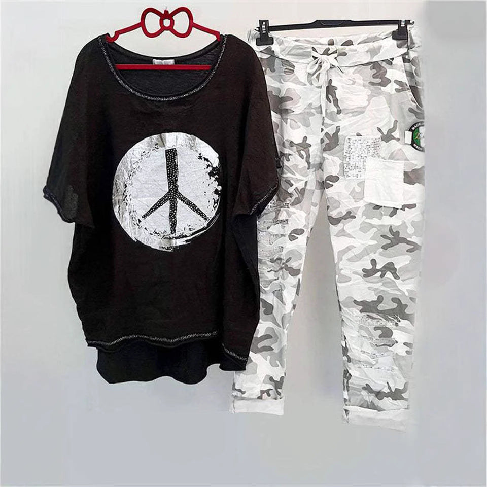 Women’s casual leisure two-piece with wide-cut linen look shirt, peace symbol and camouflage jog pants with patch details Mune Fashion