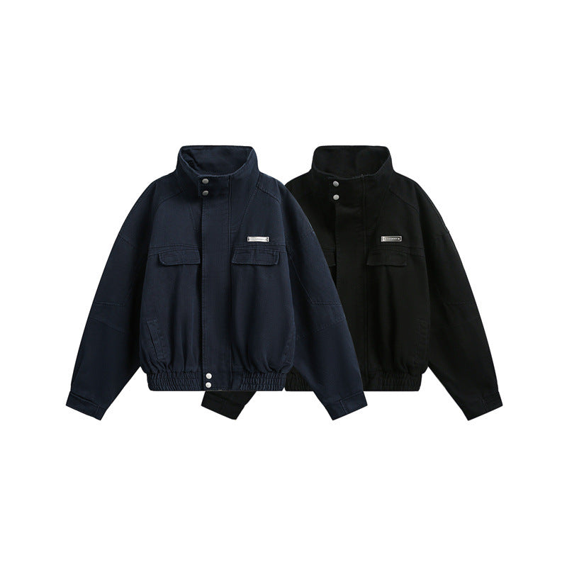 Unisex Short cut Boxy outdoor jacket with concealed zipper placket, high stand-up collar and elastic waistband Mune Fashion