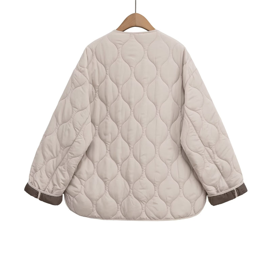 Women's non-quilted oversized quilted jacket with round neckline, full-length zipper, and patch pockets Mune Fashion