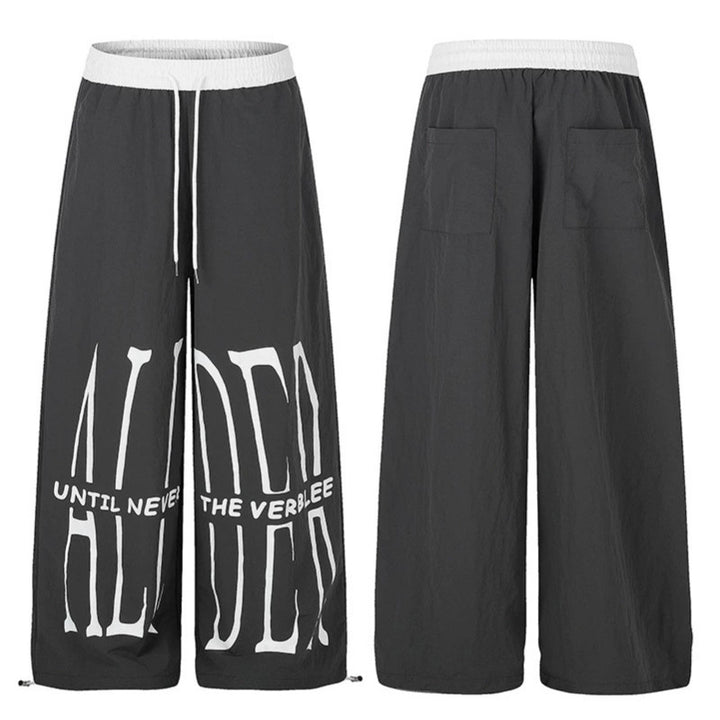 Women's wide loungewear pants with high comfort waistband, drawstring, adjustable hem, and typographic print Mune Fashion