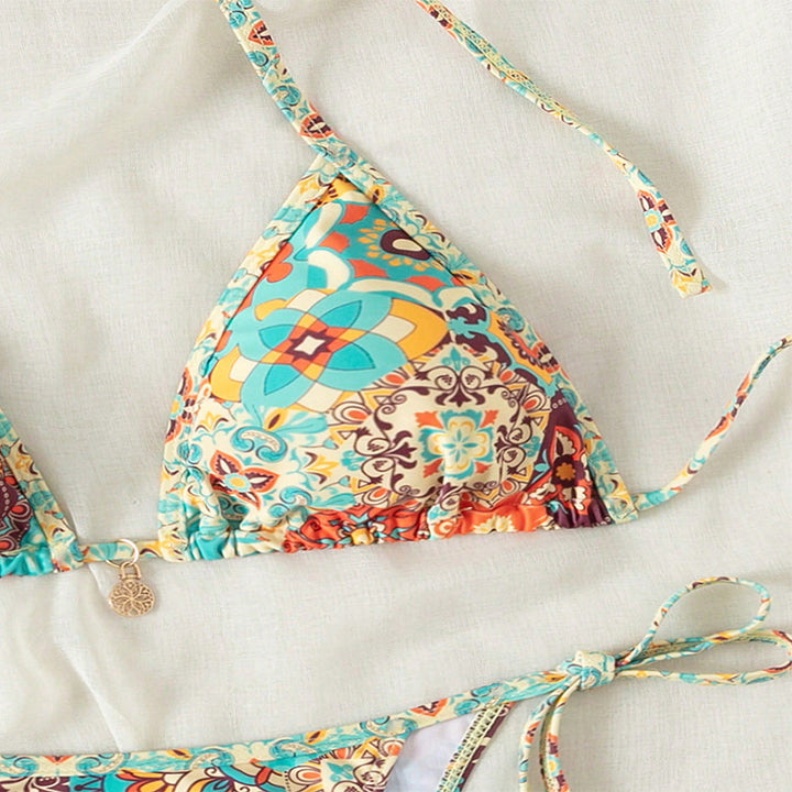 Women's triangle bikini with colorful floral pattern and adjustable lacing details Mune Fashion