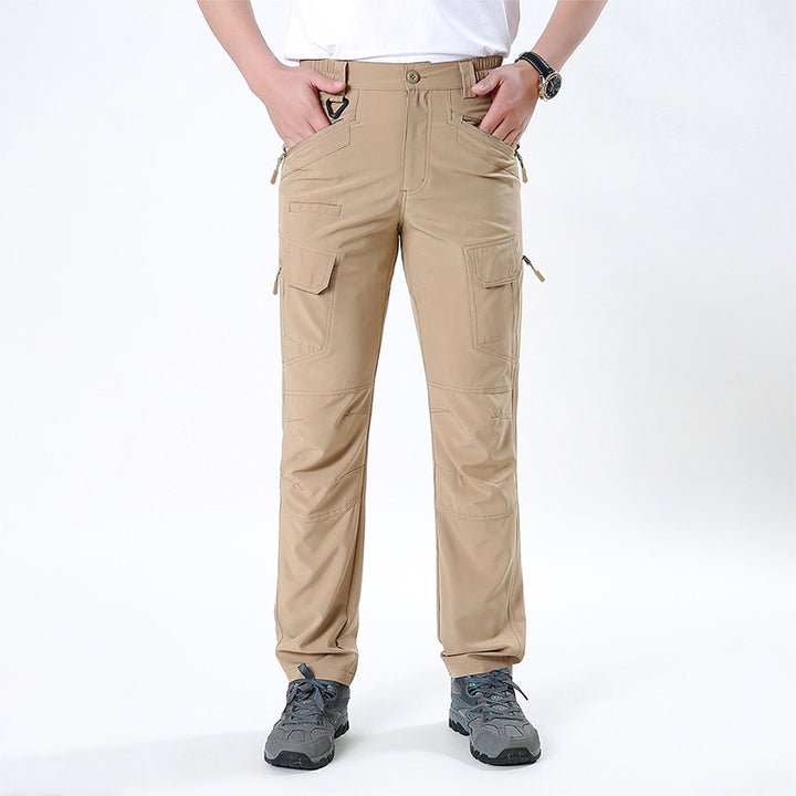 Men's nano technical trekking pants with elastic waistband, pre-shaped knees, and multiple cargo and zip pockets.