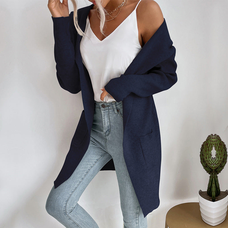 Women's longer ribbed cocoon cardigan made of lightweight fine knit with patch pockets Mune Fashion
