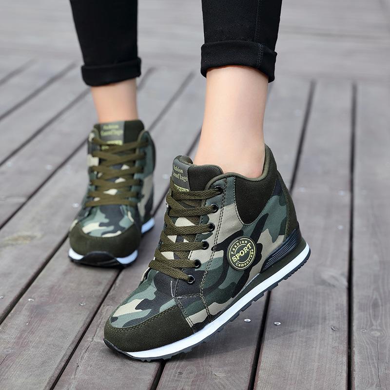 Women’s mid-high wedge running sneakers in a material mix with concealed inner wedge, padded ankle collar, and grippy tread sole Mune Fashion