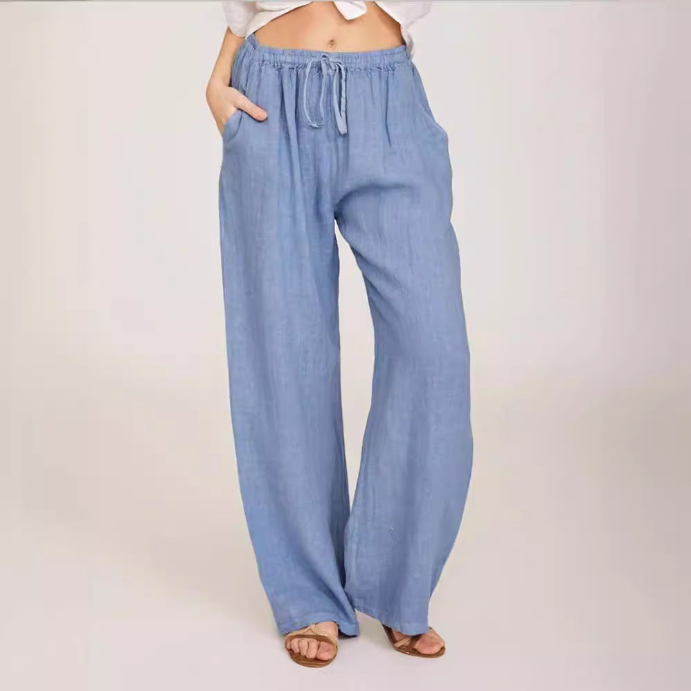 Women's airy palazzo pants with drawstring waistband, elastic waist finish, and side pockets Mune Fashion