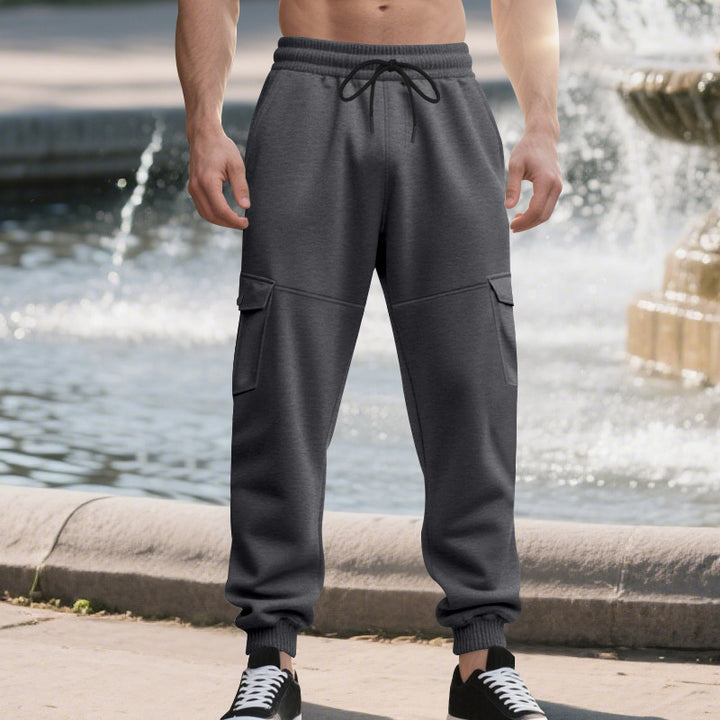 Men's urban-military cargo joggers with knee-quilted inserts, side flap pockets, and ribbed leg openings Mune Fashion