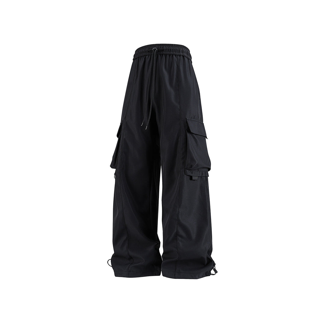 Men's wide utility cargo pants in baggy cut with drawstring waistband, large flap pockets, and adjustable leg hems Drune