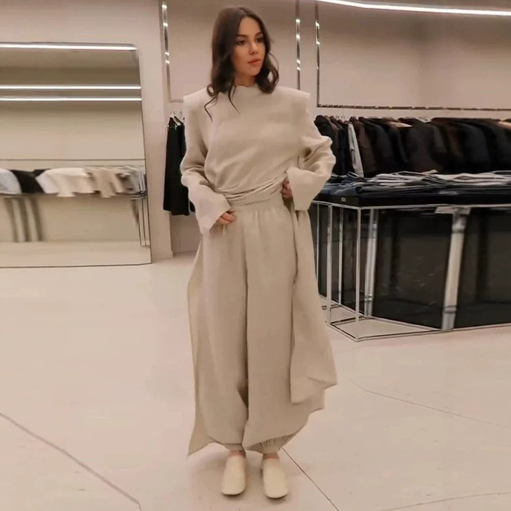Women’s maxi dress with tailored silhouette, flared skirt and striking shoulders Mune Fashion
