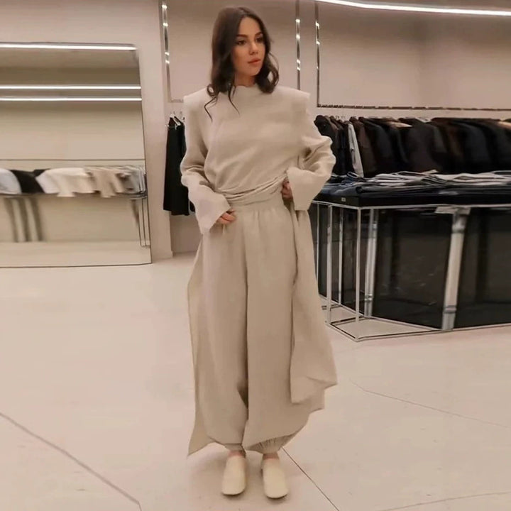 Women’s maxi dress with tailored silhouette, flared skirt and striking shoulders Mune Fashion