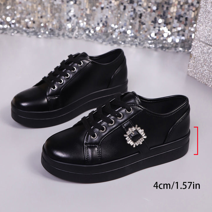 Ladies' platform sneaker with metallic upper material, decorative rhinestone buckle, and padded comfort sole Mune Fashion