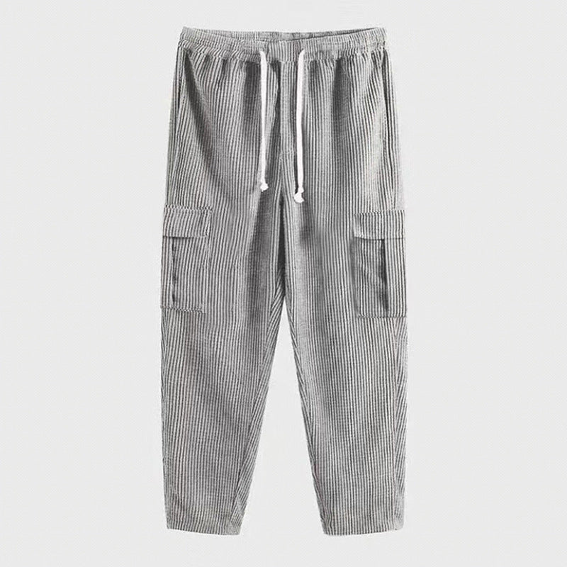 Men's corduroy jogger-style pants with elastic drawstring waistband, flap cargo pockets, and tapered leg Mune Fashion