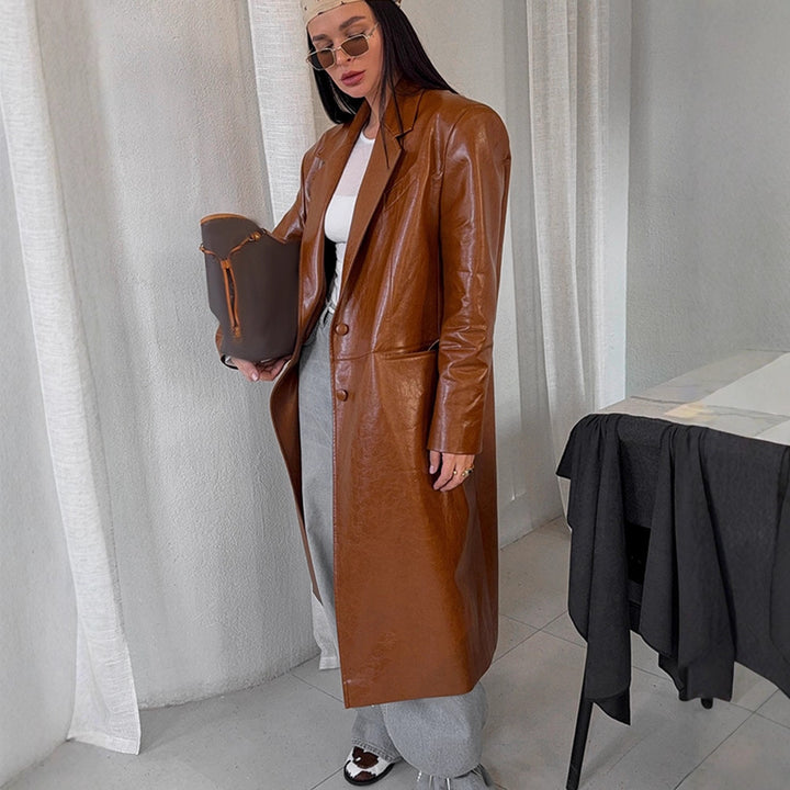 Women's long-cut patent leather trench coat with lapel collar and boxy oversized fit Mune Fashion