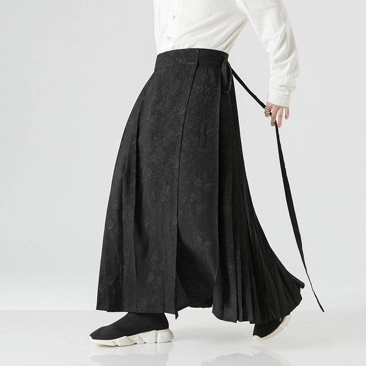 Women's maxi skirt with wide waistband, ornamental border and pleated folds Mune Fashion