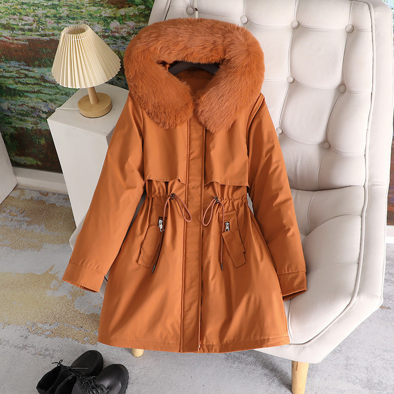 Women's mid-length water-repellent parka with voluminous faux fur collar, waistband drawstring, and multifunctional flap pockets Mune Fashion