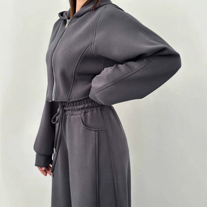 Women's loose high-waist lounge pants with drawstring, side pockets, and decorative seams Mune Fashion