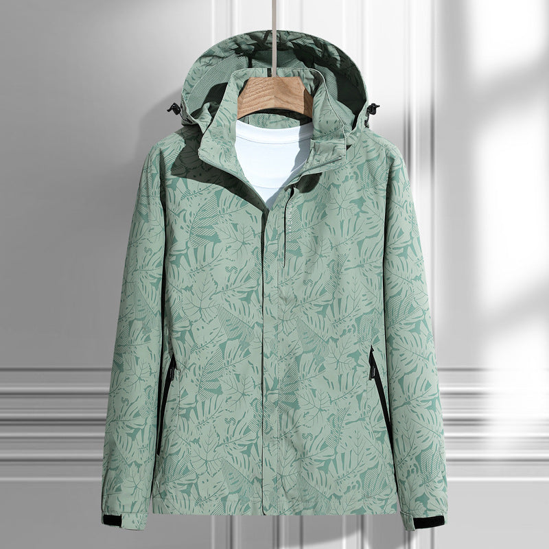 Women's lightweight packable rain and wind jacket with hood, leaf pattern and concealed zippers Mune Fashion