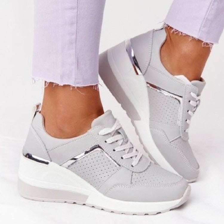 Women's wedge sneakers with perforated upper material, padded comfort collar and reflective metal details Mune Fashion