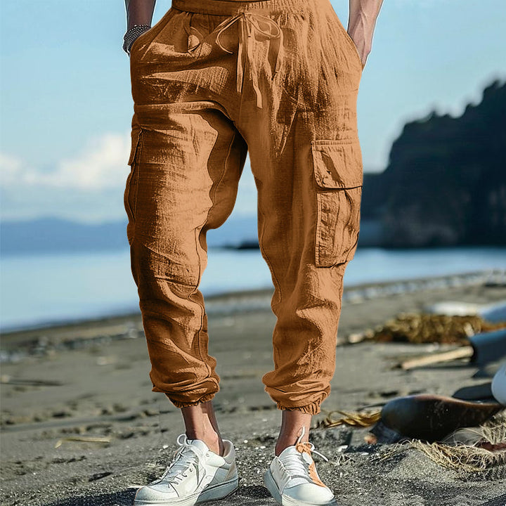Men's casual cargo pants in jogger style with crinkle linen look, drawstring waistband, and multiple pockets Mune Fashion