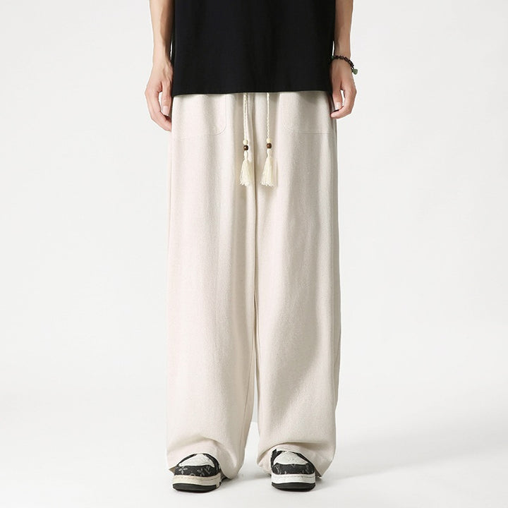 Men's loose-fitting lounge pants with tassel cord, elastic waistband, and patch pockets Mune Fashion