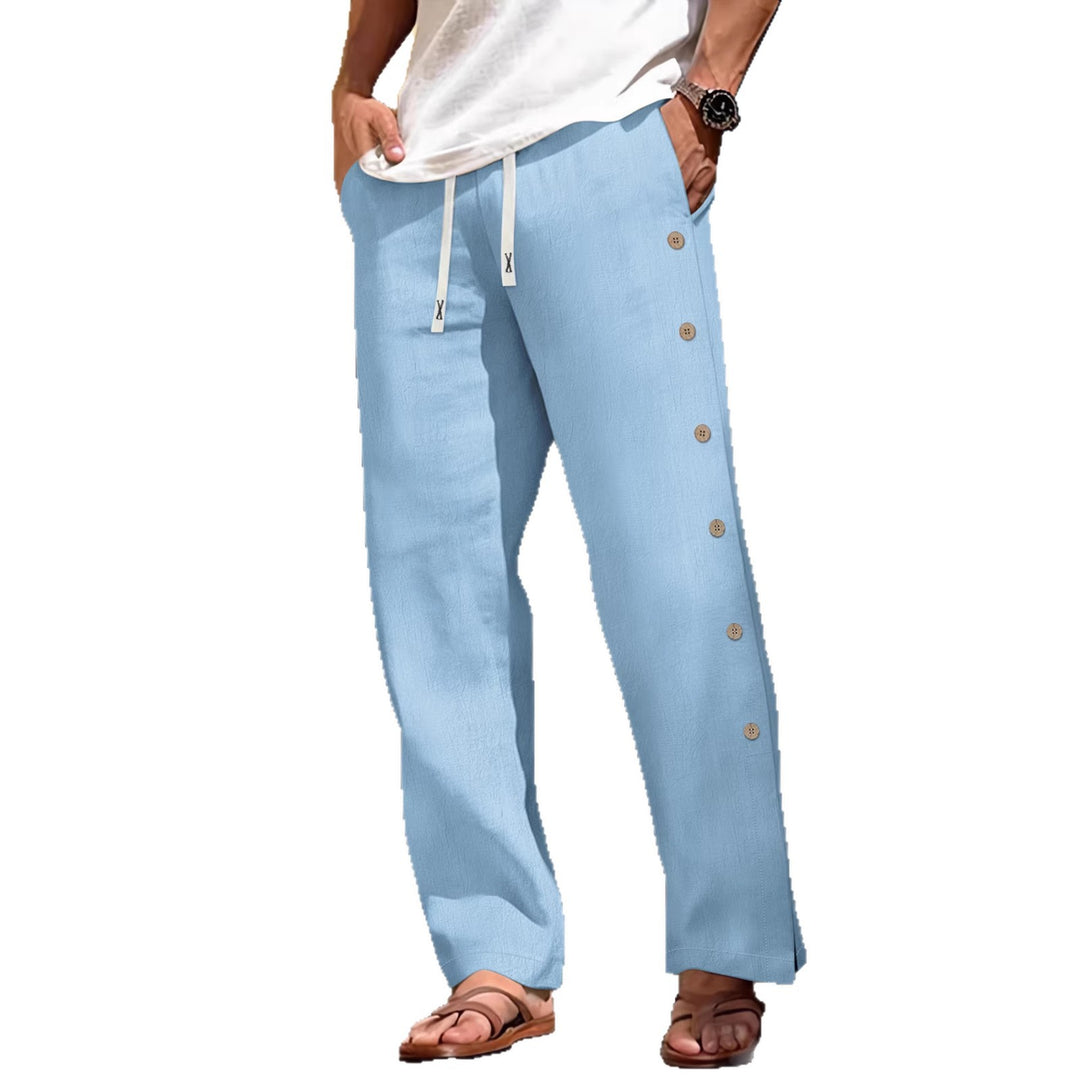 Men's loose leisure pants with side decorative button placket, drawstring waistband, and deep front pockets Mune Fashion