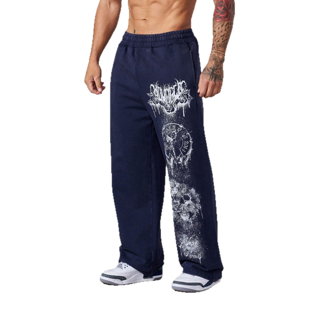 Men's baggy joggers with elastic waistband, side pockets and detailed skull and rose motif Mune Fashion