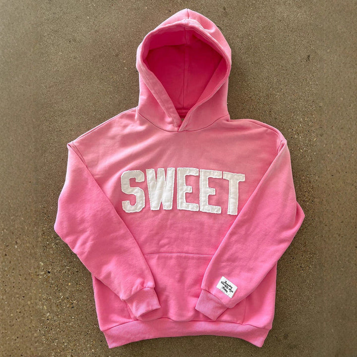 Unisex nan oversized hoodie with appliquéd letter patches and kangaroo pocket Mune Fashion