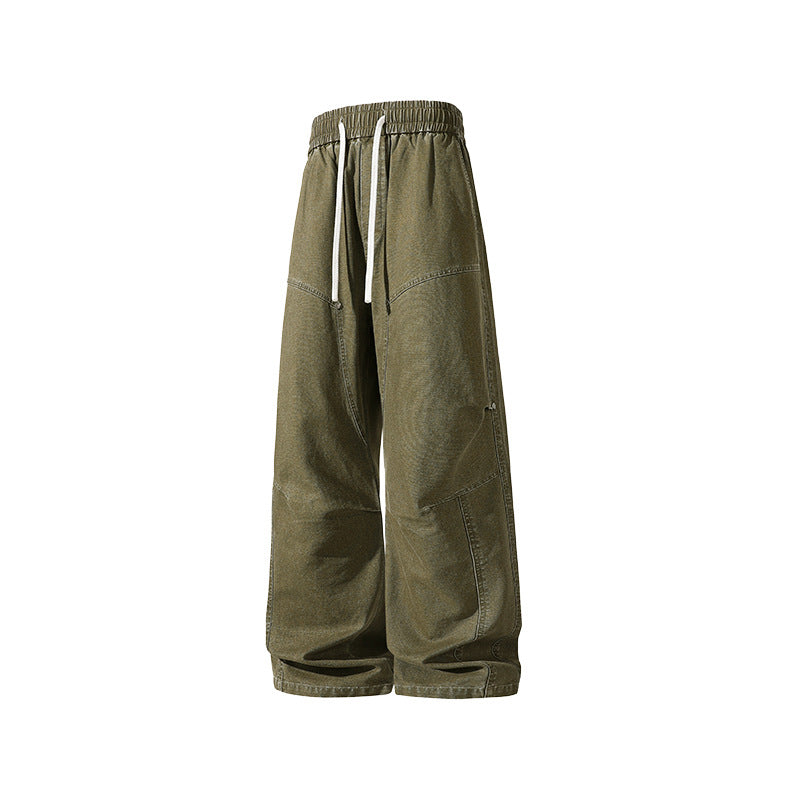 Men's wide baggy cargo pants made of washed canvas with elastic waistband and decorative stitching panels Drune