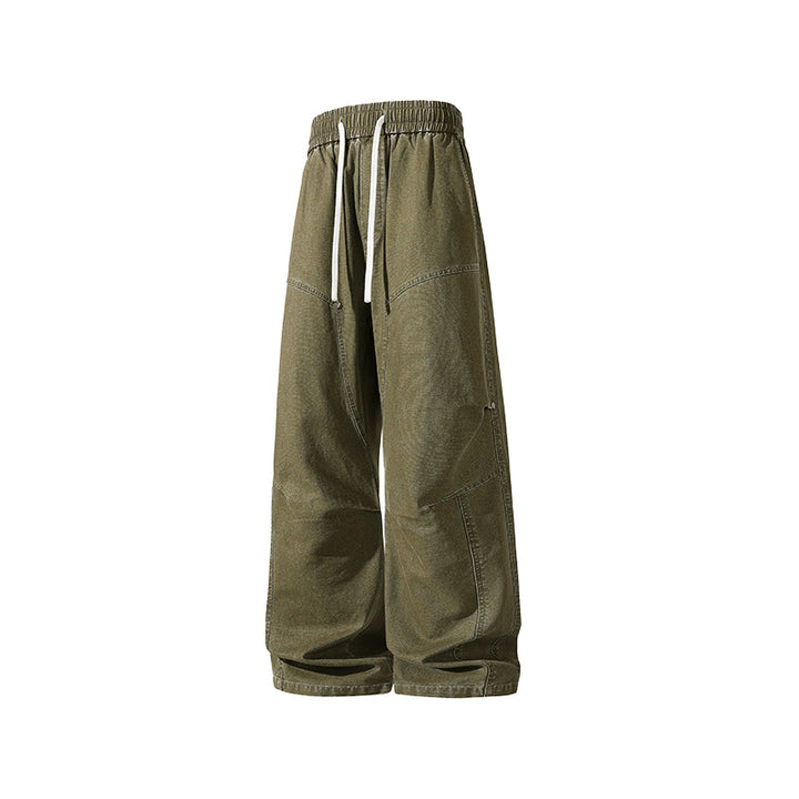 Men's wide baggy cargo pants made of washed canvas with elastic waistband and decorative stitching panels Drune