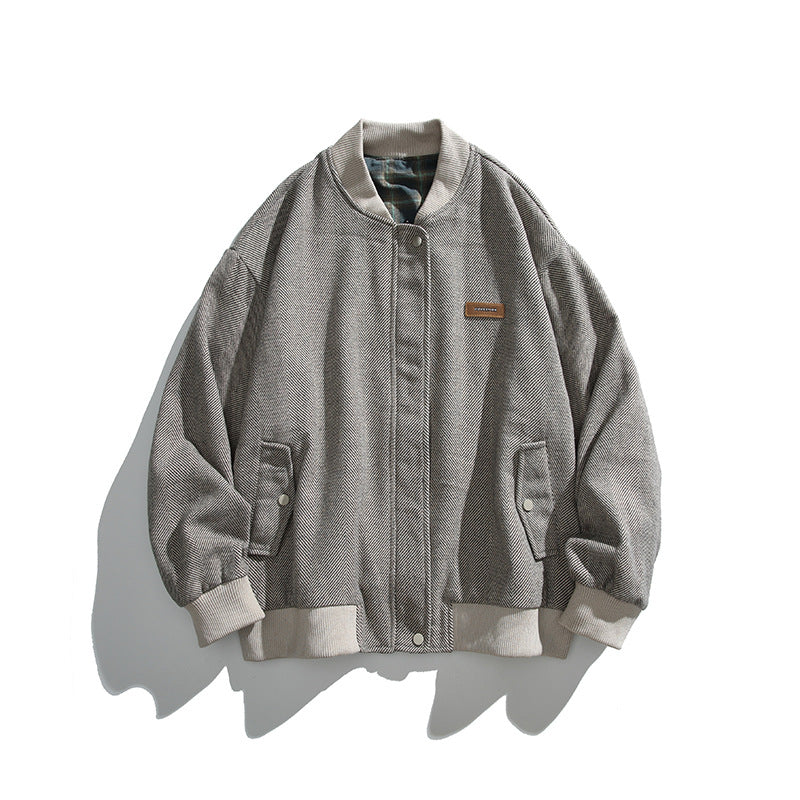 Unisex boxy bomber jacket in herringbone look with ribbed cuffs, flap pockets, and concealed snap button placket Mune Fashion